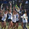 Guilford celebrates after beating Cheshire to win the SCC girls lacrosse championship on Thursday at Ken Strong Stadium in West Haven.