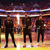 Andrew Wiggins #22, Jordan Poole #3, Kevon Looney #5, Moses Moody # and Klay Thompson #11 of the Golden State Warriors stand for the national anthem prior to Game Five of the 2022 NBA Playoffs Western Conference Finals against the Dallas Mavericks at Chase Center on May 26, 2022 in San Francisco, California. 