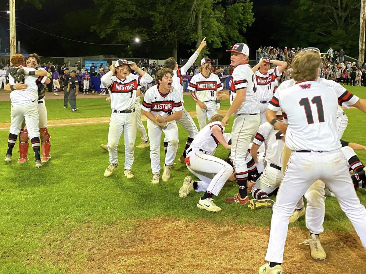 Members of the Fairfield Warde baseball team celebrate after defeating Westhill 4-1 Thursday night for the FCIAC tournament championship at Cubeta Stadium.