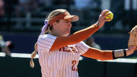 Texas starter Hailey Dolcini delivers a pitch during an NCAA softball game against Washington on Saturday, May 21, 2022, in Seattle. Texas won 8-2. (AP Photo/Stephen Brashear)