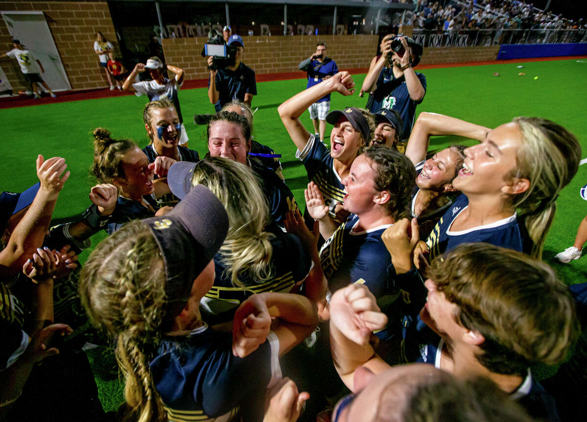 Lake Creek Lions players celebrate after their 7-2 Region III-5A championship win over Santa Fe, Thursday, May 26, 2022, at CE King. (Juan DeLeon/Contributor) 