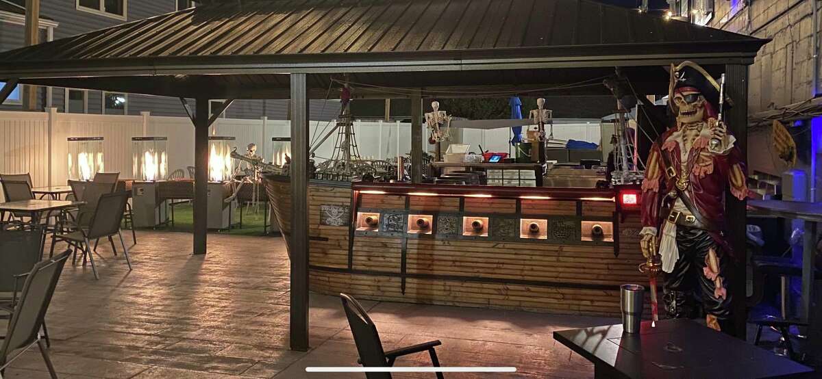 Lake Street Local in Port Austin has a pirate-themed bar and patio area called The Pirate's Cove that is open during the summer. This year will feature a new pirate statue Captain Austin, right. 