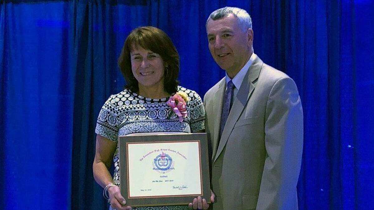 Platt Tech softball coach and athletic director Sue Murphy, left, pictured here receiving the 2018 Connecticut High School Coaches Association Softball Coach of the Year.