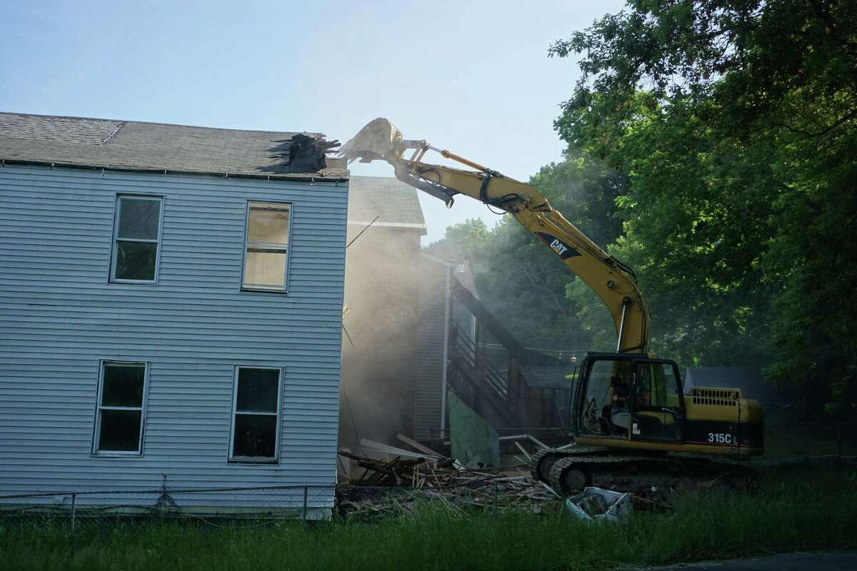 The zombie property at 660 Fourth St., Troy, N.Y. is demolished on May 25, 2022.