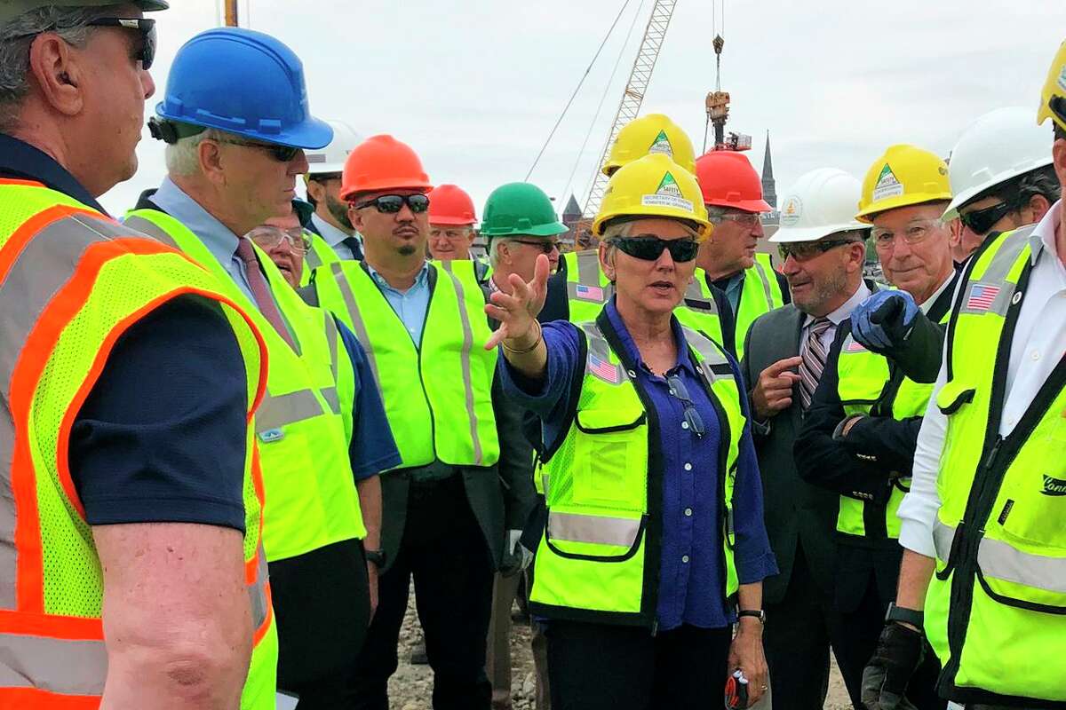 U.S. Energy Secretary Jennifer Granholm, center, tours the New London State Pier facility May 20 to view progress on a hub for the offshore wind power industry in New London.