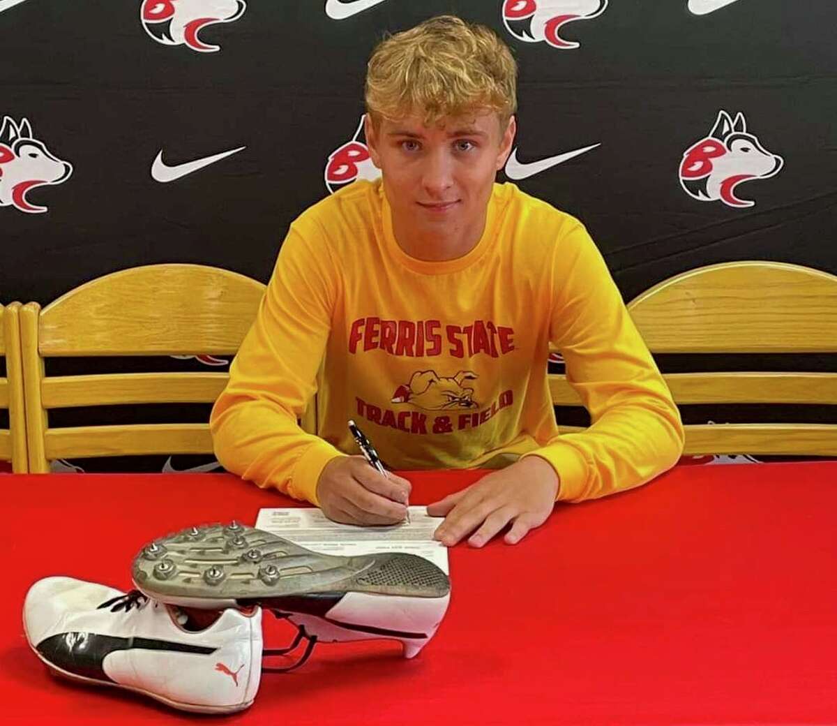 Benzie Central's Devon Harris signed his national letter of intent to continue long jumping at Ferris State University on Thursday. 