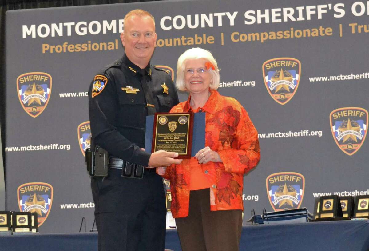 Marie Underdown, right, representing SPCA PETS SNAP of Montgomery County, pictured with Montgomery County Sheriff Rand Henderson. Recently the Sheriff’s Office held an awards and promotions ceremony. SPCA PETS SNAP of Montgomery County was honored for this organization’s support for the Sheriff’s Office K-9s and their human partners.
