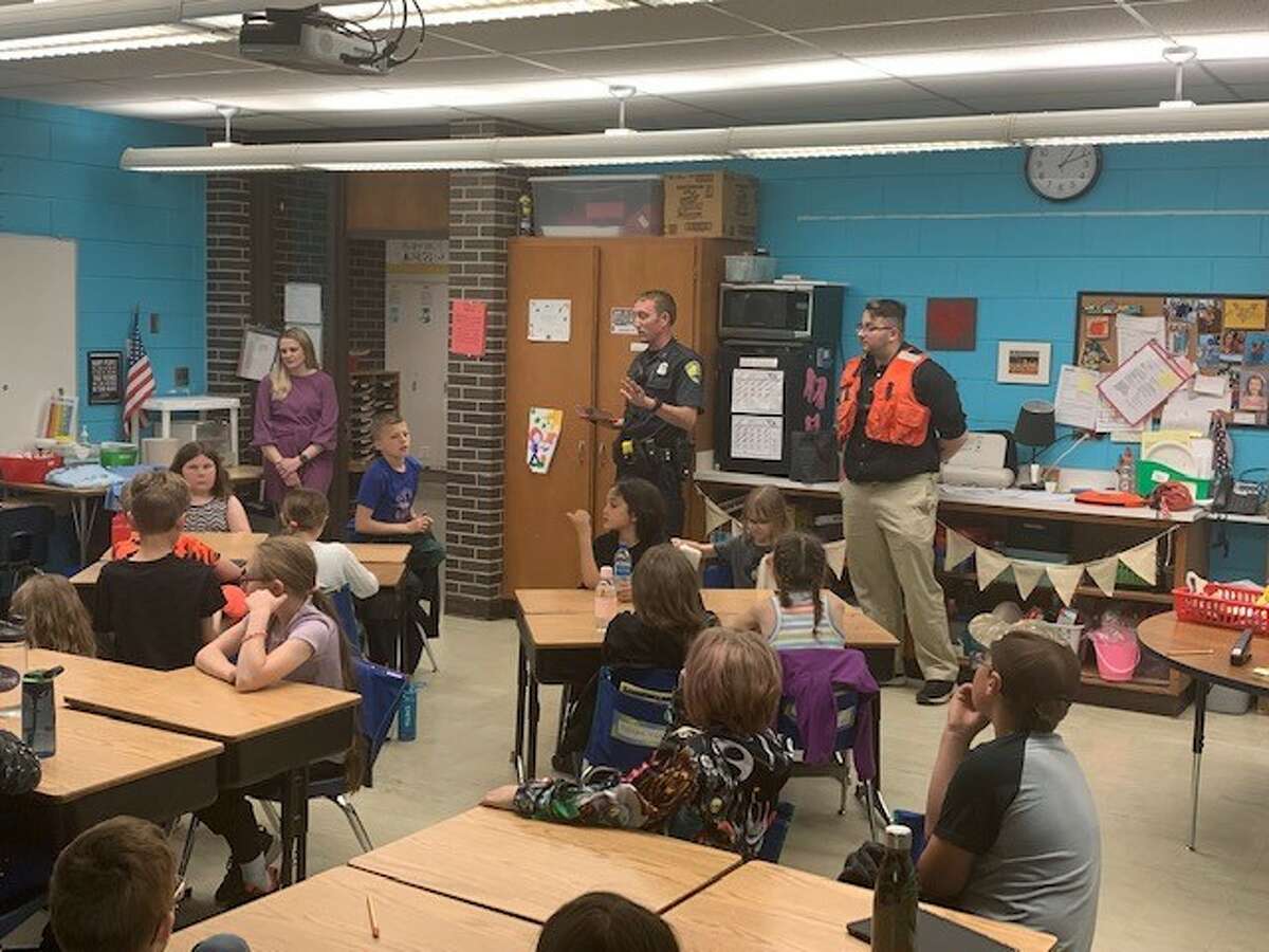 Officer Jeremiah Haner is shown speaking to Kennedy Elementary School students during a water safety presentation on Tuesday.