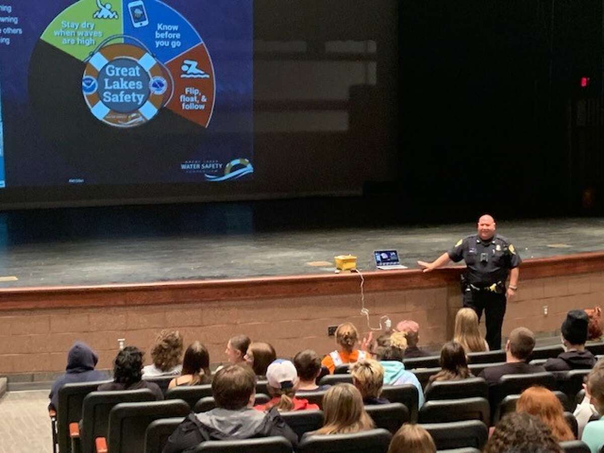 Officer David Shands teaches Manistee Middle High School students about how to avoid drowning during a presentation on Friday. 