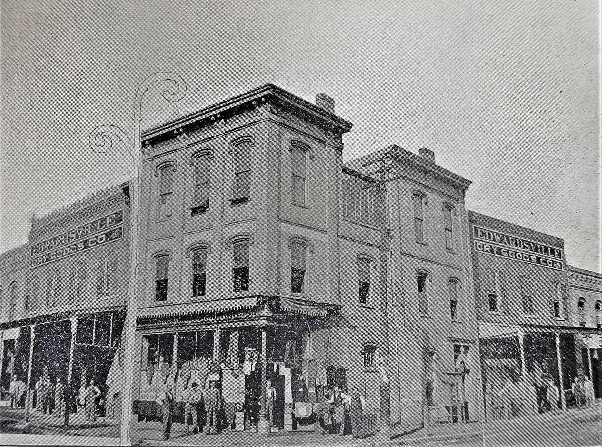The Edwardsville Dry Goods Company in 1895. Fred Bernius was one of four founders of the company. The building was located at the corner of Main and Purcell streets. It was torn down in 1917 when the new five-story Bank of Edwardsville was built. In 1990 the bank building was taken down to make room for the new Madison County Administration Building.