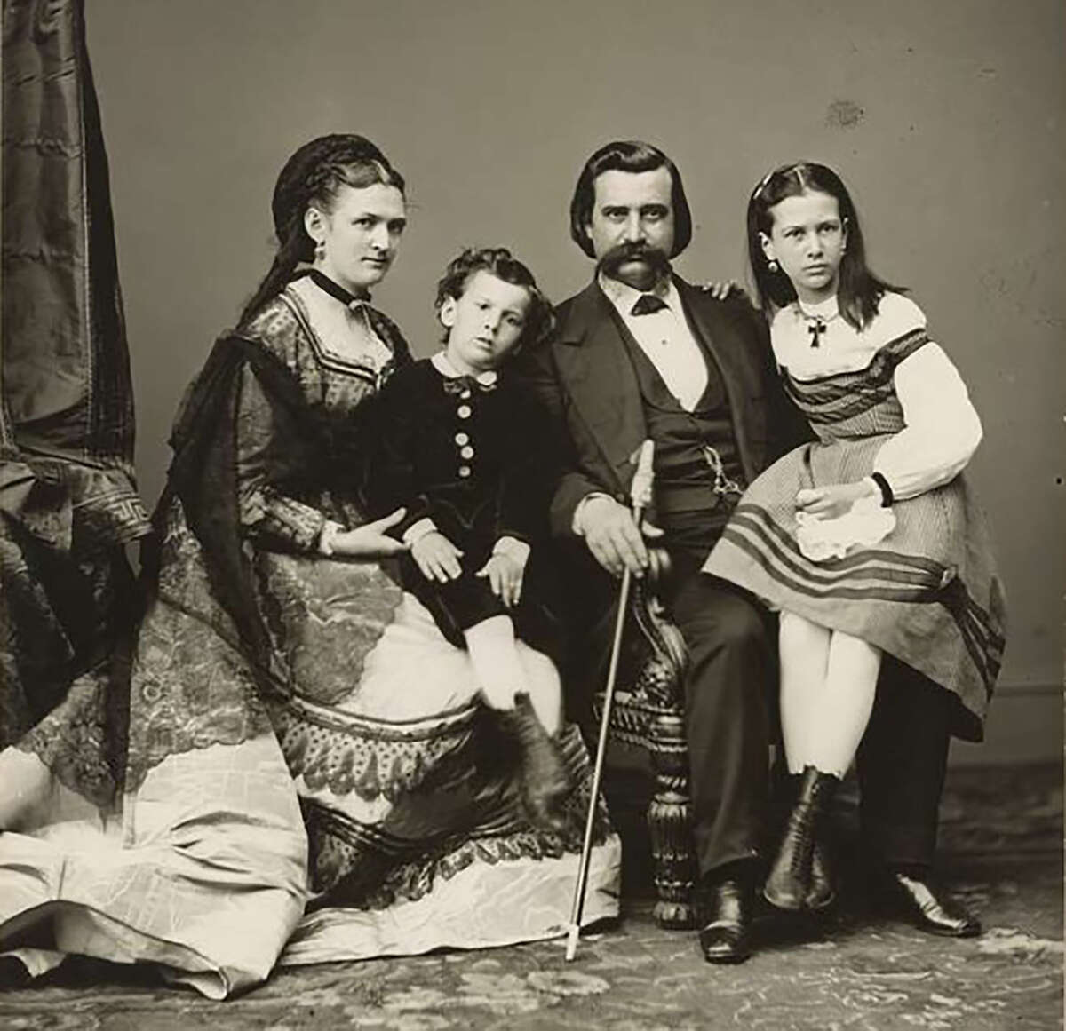 John A. Logan (second from right) sits for a portrait with his family, including his wife, Mary (from left);  his son, John Jr.; and his daughter, Mary Elizabeth. Before Logan was an Illinois state representative and a U.S. senator, he was a respected Civil War general. He is credited with formally creating Memorial Day.