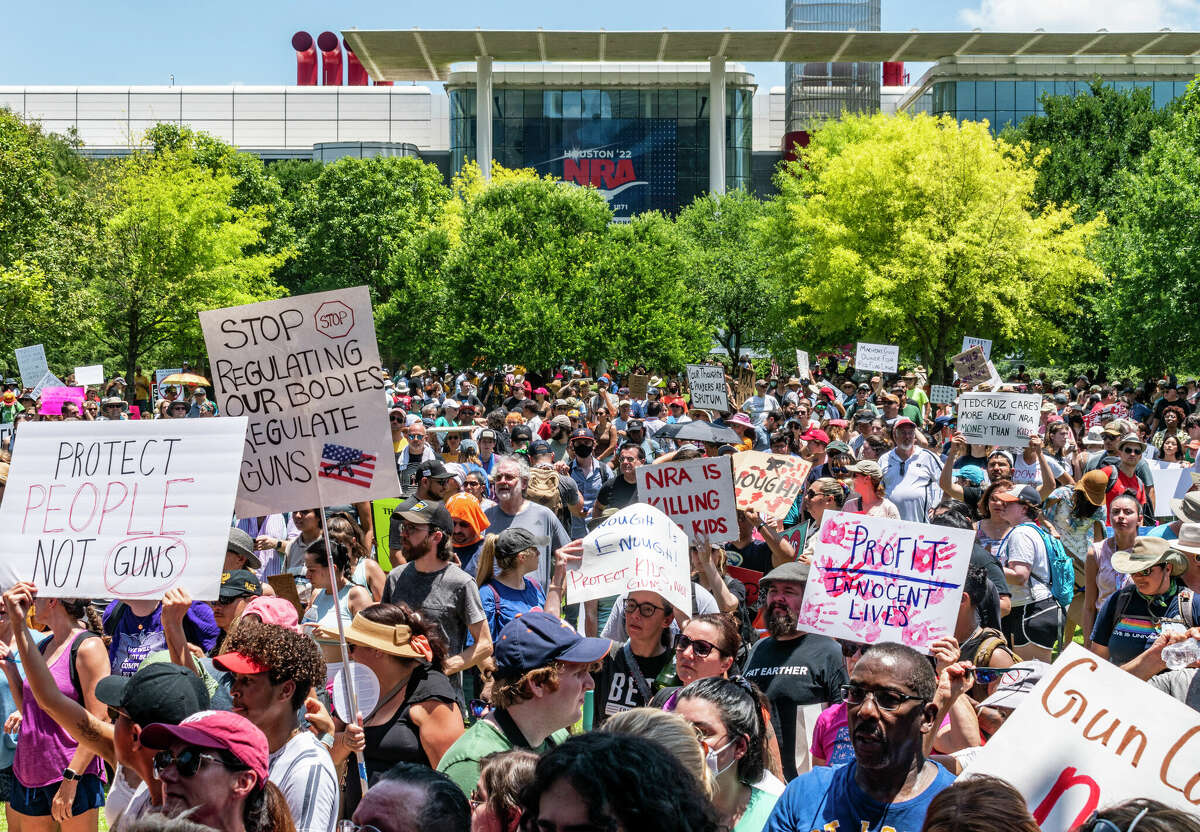 Thousands of people protest the National Rifle Association's annual meeting in downtown Houston on Friday, May 27, 2022, days after a gunman killed 19 children and two teachers at a Uvalde elementary school.