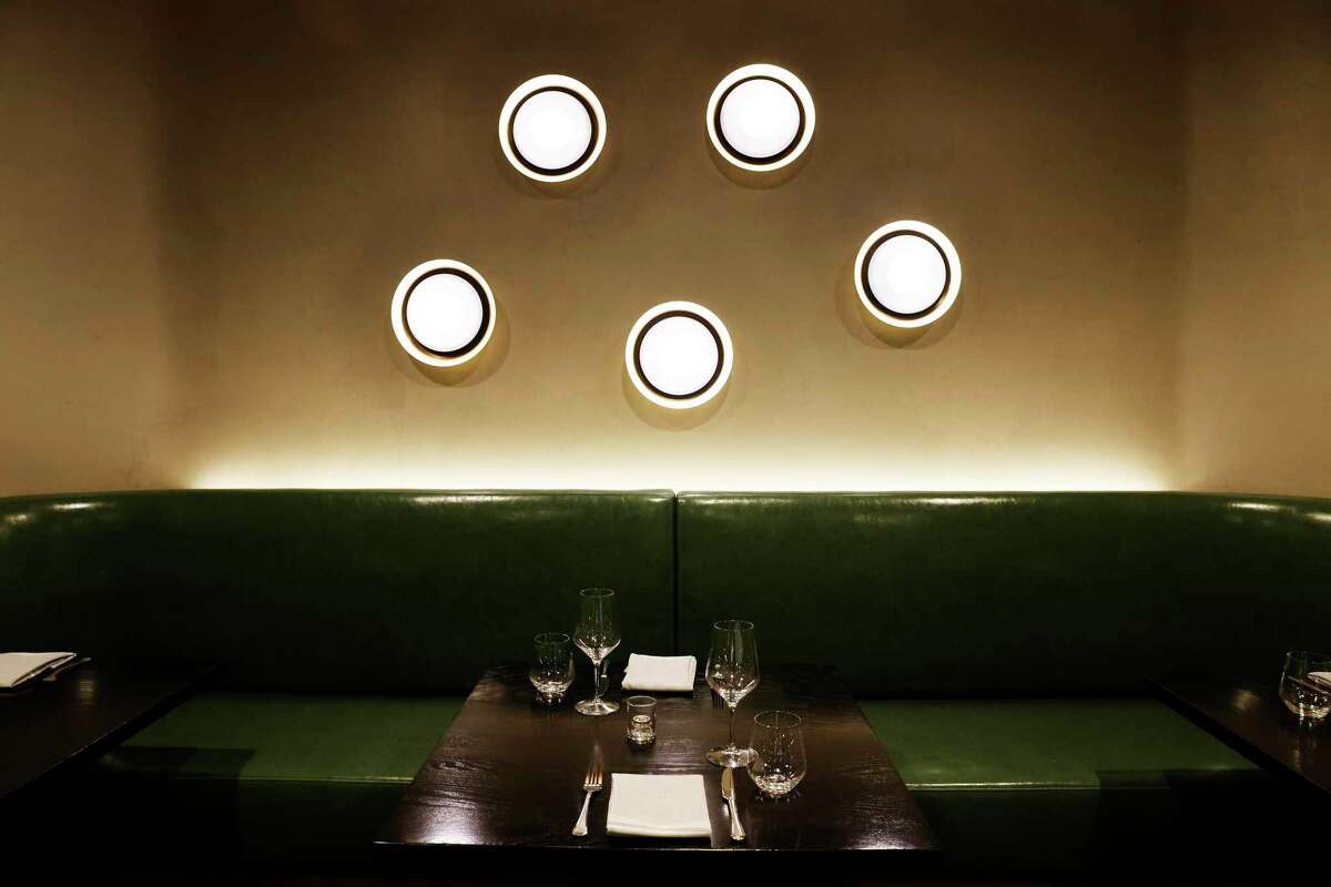 A private dining room features soft lighting at Occitania in Oakland.