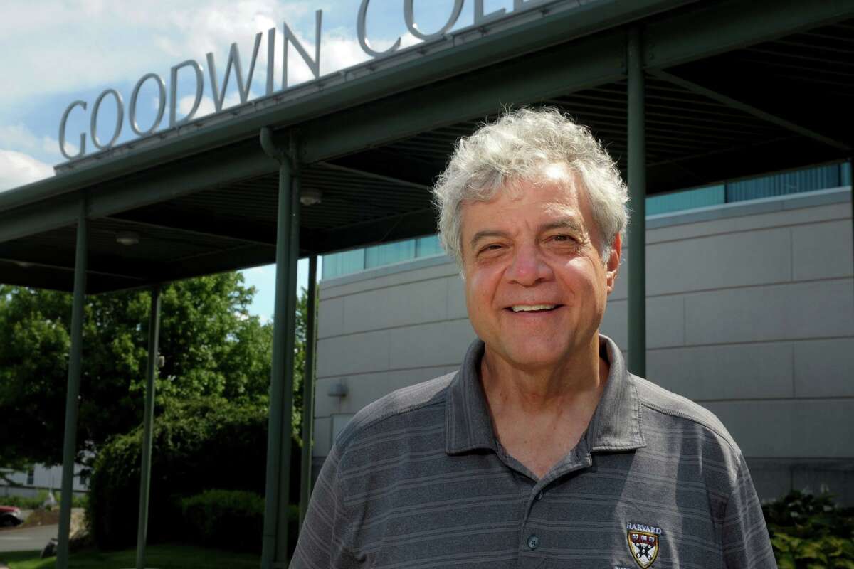 Goodwin University President Mark Scheinberg poses in front of the main building on the campus in East Hartford, Conn. July 14, 2020.