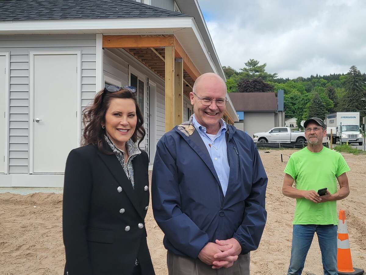 Gov. Gretchen Whitmer and Jon Stimpson, executive director of Homestretch, the organization building the apartments in Honor, during Whitmer's visit on May 27. 