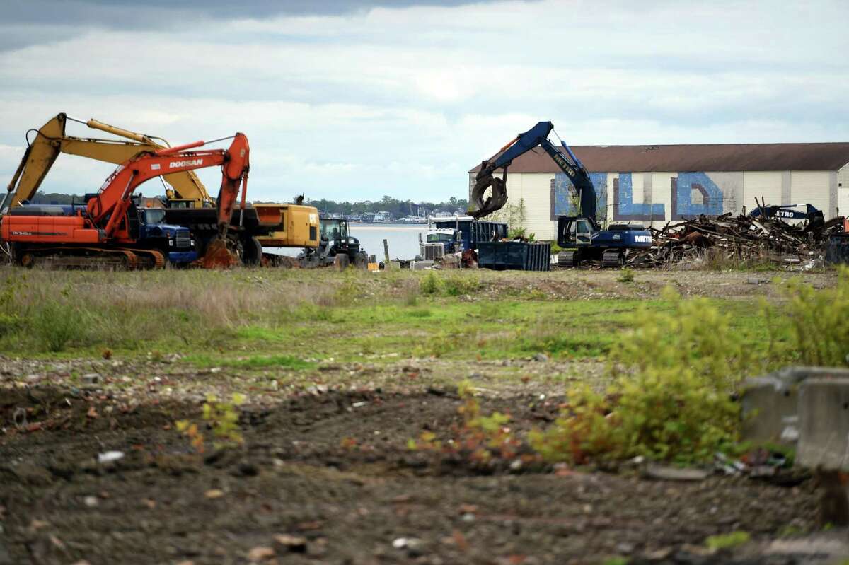 Debris from demolished buildings is cleared for The Haven project on Water Street in West Haven on May 10, 2021.
