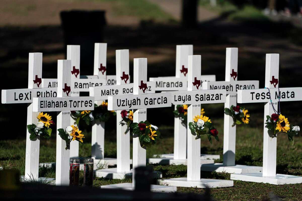 Crosses with the names of Tuesday's shooting victims are placed outside Robb Elementary School in Uvalde, Texas, Thursday, May 26, 2022. (AP Photo/Jae C. Hong)