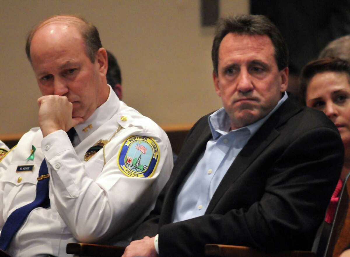 Newtown Police Chief Michael Kehoe and Neil Heslin, father of Jesse Lewis, a Sandy Hook vicitim, listen to the Bipartisan Task Force on Gun Violence Prevention and Children's Safety hearing at Newtown High School. Mara Lavitt/New Haven Register 1/30/13