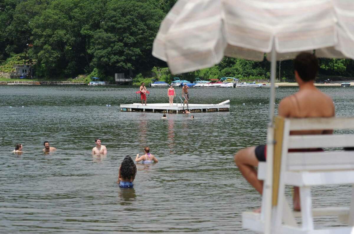 Swimmers play in the water at Candlewood Town Park in Danbury, Conn., in June 2013.