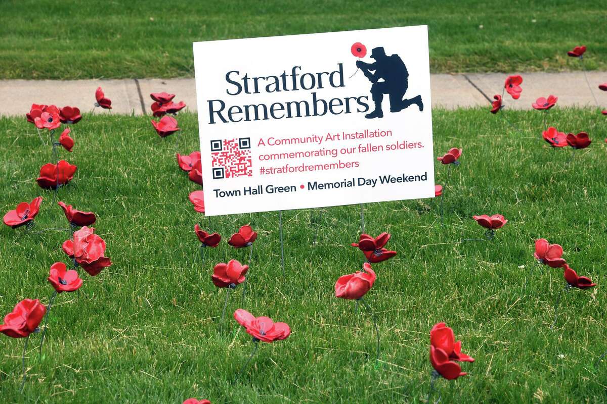 Ceramic poppies and American flags have been placed in front of Town Hall, part of the Stratford Remembers project in Stratford, Conn. May 27, 2022.