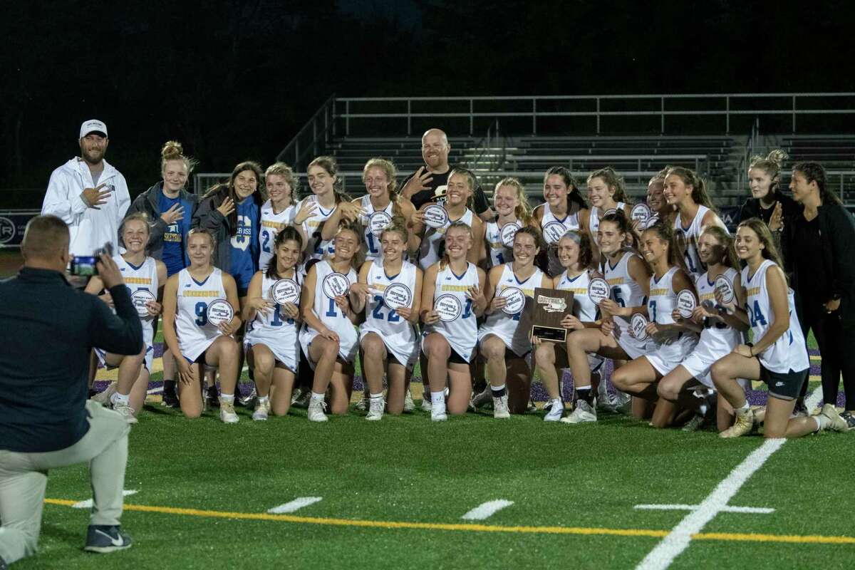 Queensbury players celebrate after defeating Niskayuna in the Class B girls' lacrosse final held at Christian Brothers Academy on Friday, May 27, 2022 in Colonie, N.Y.