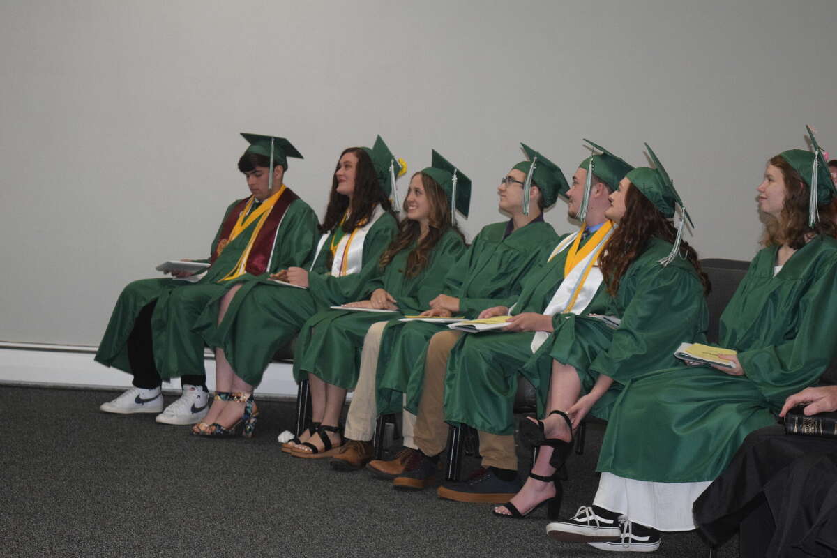 Graduates for the 2022 class from Westfair Christian Academy listen to speakers during the commencement ceremony Friday. There were seven graduates: (Right to Left) Kaitlyn Baker, Allison Bowker, Colton Bunch, Nicholas Montgomery, Isabella Piazza, Anaston Prevett, Evan Williams.