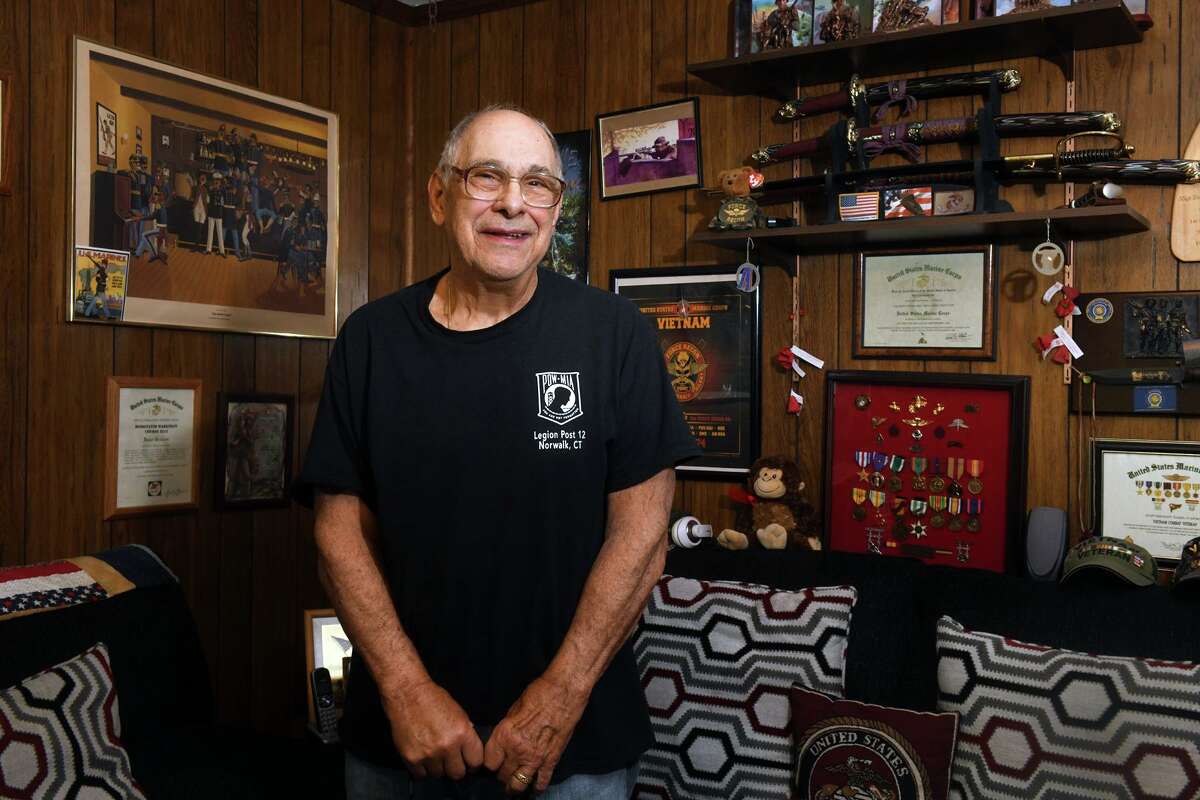 U.S. Marine Corps veteran Daniel Caporale poses at home in Norwalk, Conn. May 27, 2022. Caporale served in the marines during the Vietnam War and has been selected as Grand Marshal of this year’s Memorial Day parade in Norwalk.