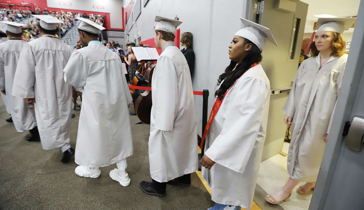 Alton High School returns to gymnasium for graduation