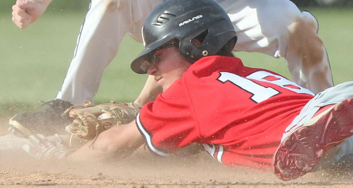 Triopia shortstop Brayden Booth tags out a Monmouth United runner at second base during a baseball game Wednesday in the semifinals of the Routt Sectional.