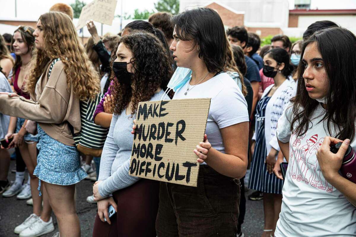 Students from McLean High School in McLean, Va., participate in a walkout on May 26.