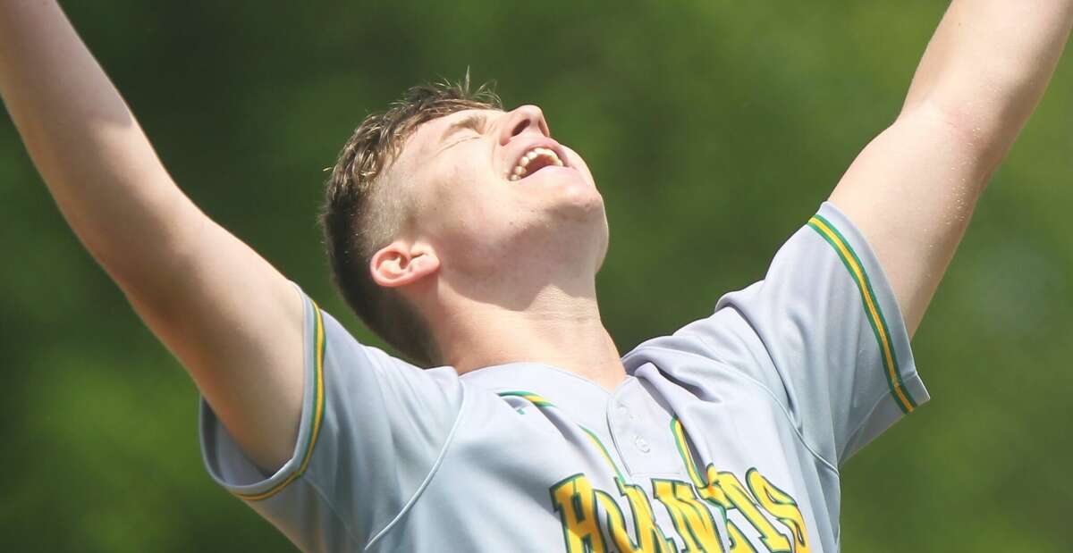 Brown County pitcher Mason Henry celebrates after the final out in a win over Triopia for the Routt Sectional championship on Saturday.