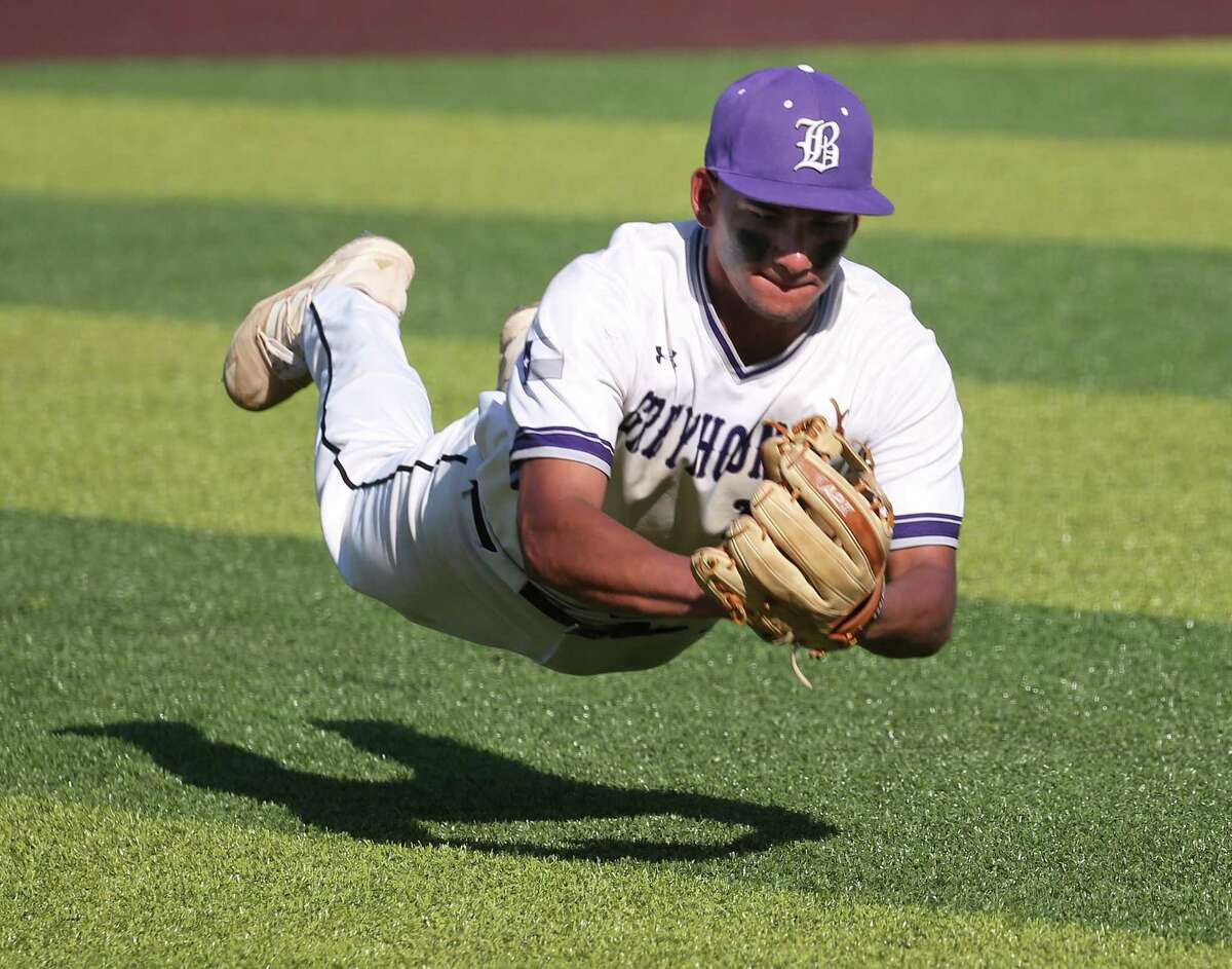 Boerne relief pitcher Kalob Sanchez (18) dives to make a catch on an attempted bunt in Game 2 as the Greyhounds defeated Corpus Christi Calallen 3-2 in eight innings in a regional semifinal on Saturday, May 28, 2022 at North East Sports Park.