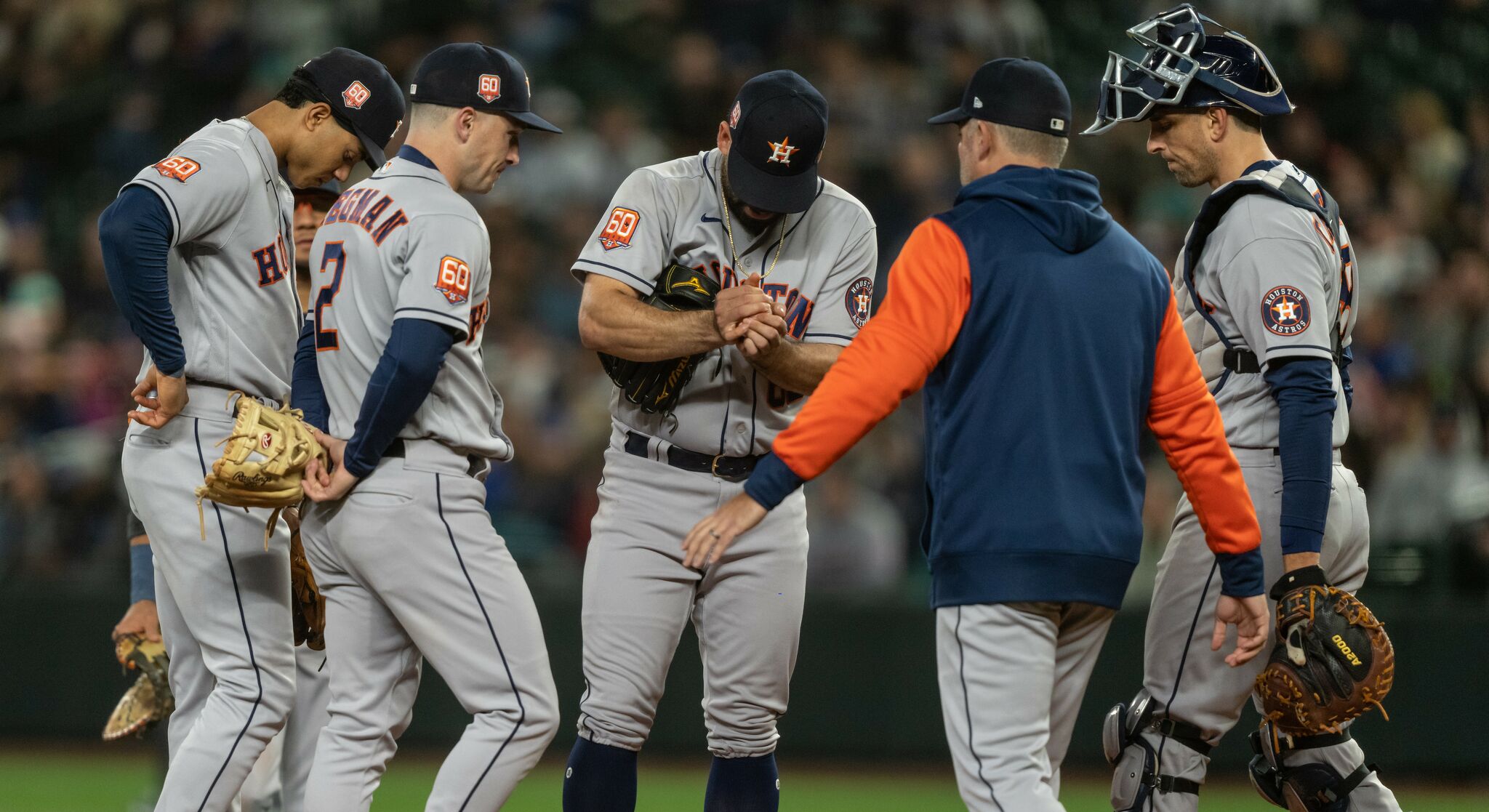 Seattle Mariners' Kyle Lewis, left, is greeted by Taylor Trammell