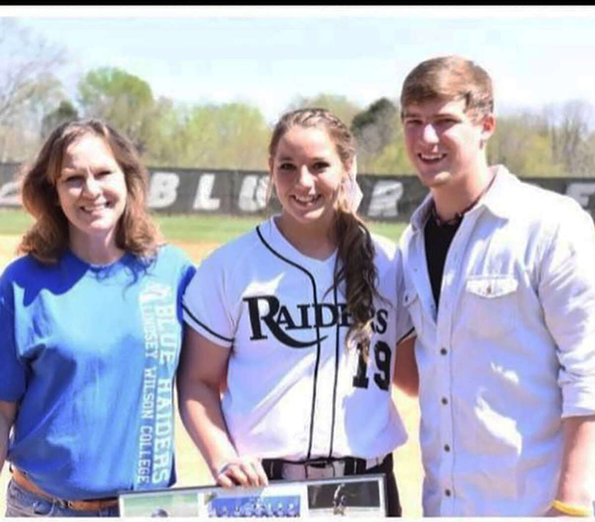 Metro-East graduate Amanda Trampe, middle, with her mother, Shari Meyer, and her brother, Jonathan Trampe, on Senior Day in 2015 at Lindsey Wilson College