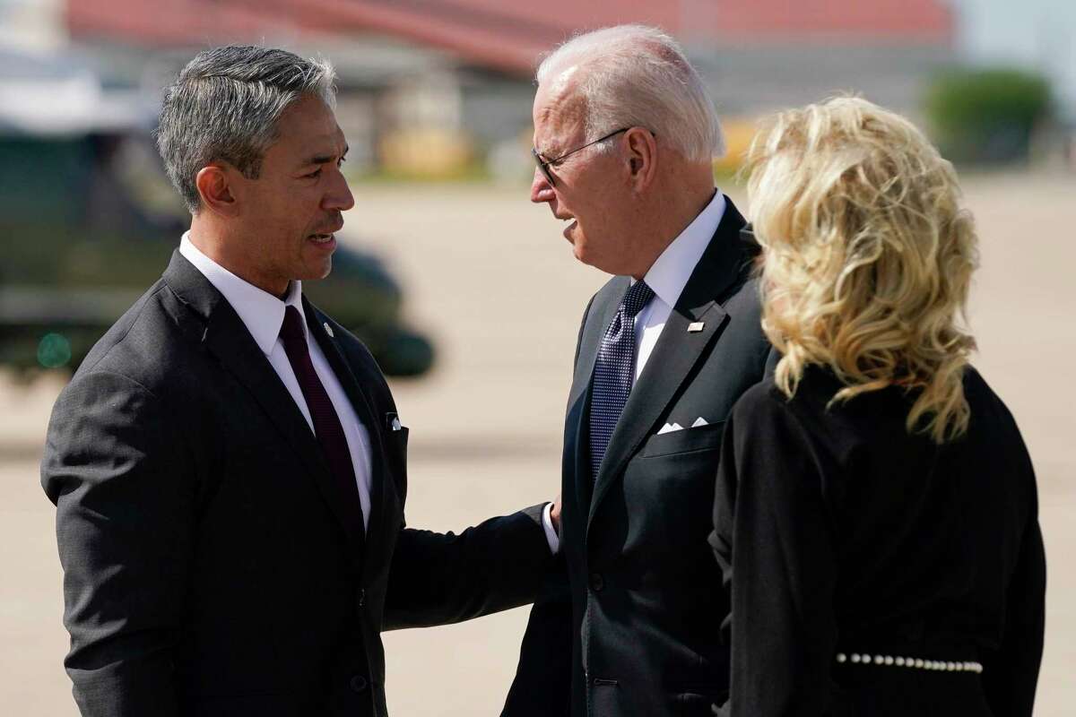 President Joe Biden and first lady Jill Biden talk with San Antonio Mayor Ron Nirenberg as they arrive at JASA-Kelly Airfield before visiting Robb Elementary School to pay their respects to the victims of the mass shooting, Sunday, May 29, 2022, in San Antonio, Texas.