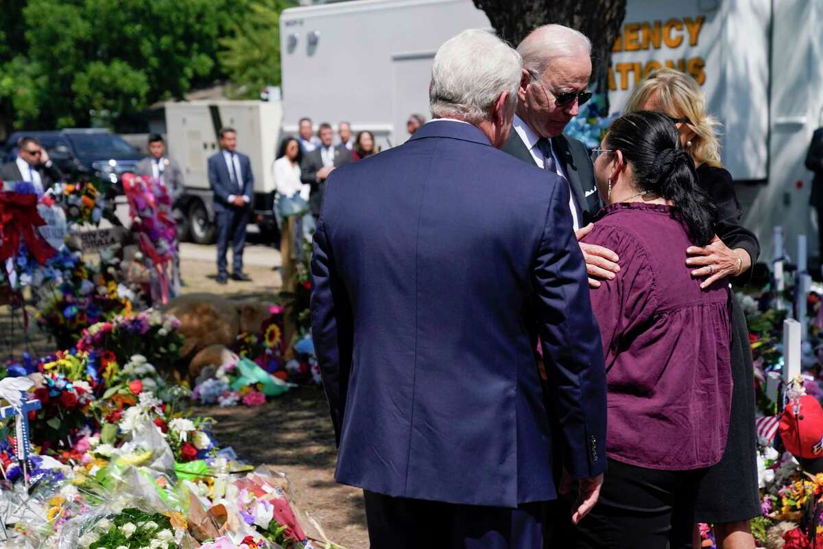 President Joe Biden and first lady Jill Biden talk with principal Mandy Gutierrez and superintendent Hal Harrell as they visit Robb Elementary School to pay their respects to the victims of the mass shooting, Sunday, May 29, 2022, in Ulvade, Texas.