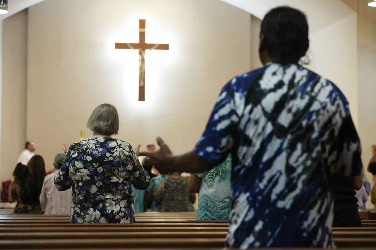 People worship during Mass at Sacred Heart Church in Uvalde, Texas, Sunday, May 29, 2022. President Joe Biden and First Lady Jill Biden were expected to attend services at the church at noon.