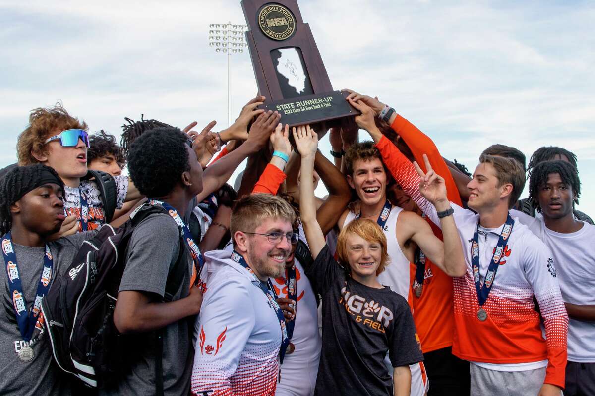 The Edwardsville boys track and field team celebrates after taking second at the Class 3A state meet on Saturday in Charleston.