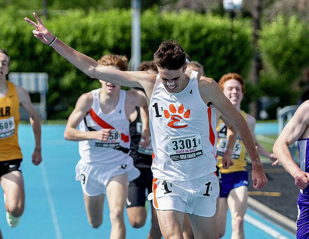 Edwardsville's Ryan Watts celebrates his win in the 1,600-meter run at the Class 3A state meet on Saturday in Charleston.