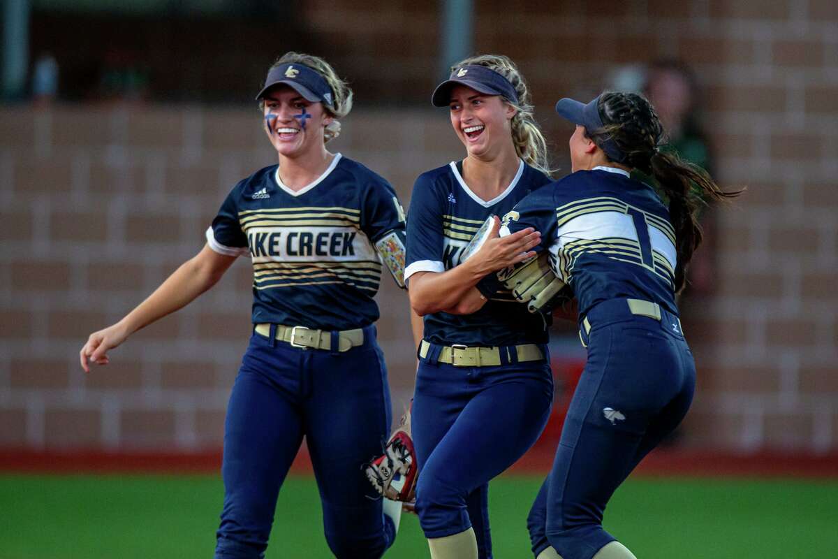 Lake Creek Lions Piper White (12) celebrates with teammates after making a catch for the out during a High school softball playoffs Region III-5A championship, Game 2 Lake Creek vs. Santa Fe, Thursday, May 26, 2022, at CE King. Lake Creek Lions defeated Santa Fe Indians 7-2. (Juan DeLeon/Contributor)