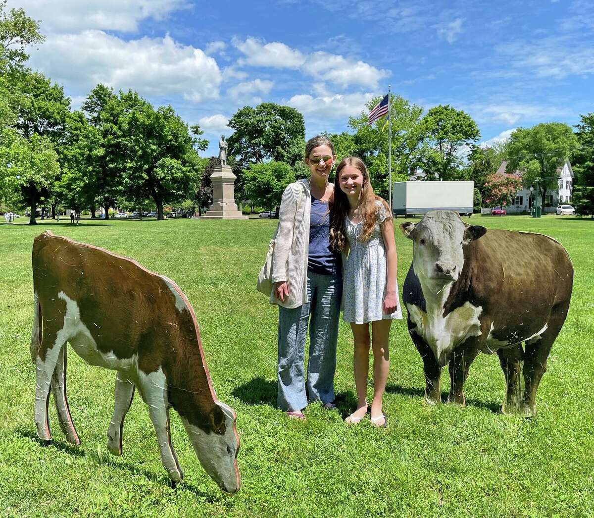 Enjoying the farm animal installation on the Guilford Green are from left, are Katie Andrus and Emma Andrus.