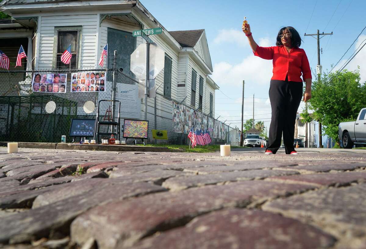Dorris Ellis Robinson, with the Freedmen's Town Preservation Coalition, performs a libations ceremony at the intersection of Andrews and Wilson streets among the bricks of Freedmen’s Town on Monday morning, May 30, 2022, in Houston.