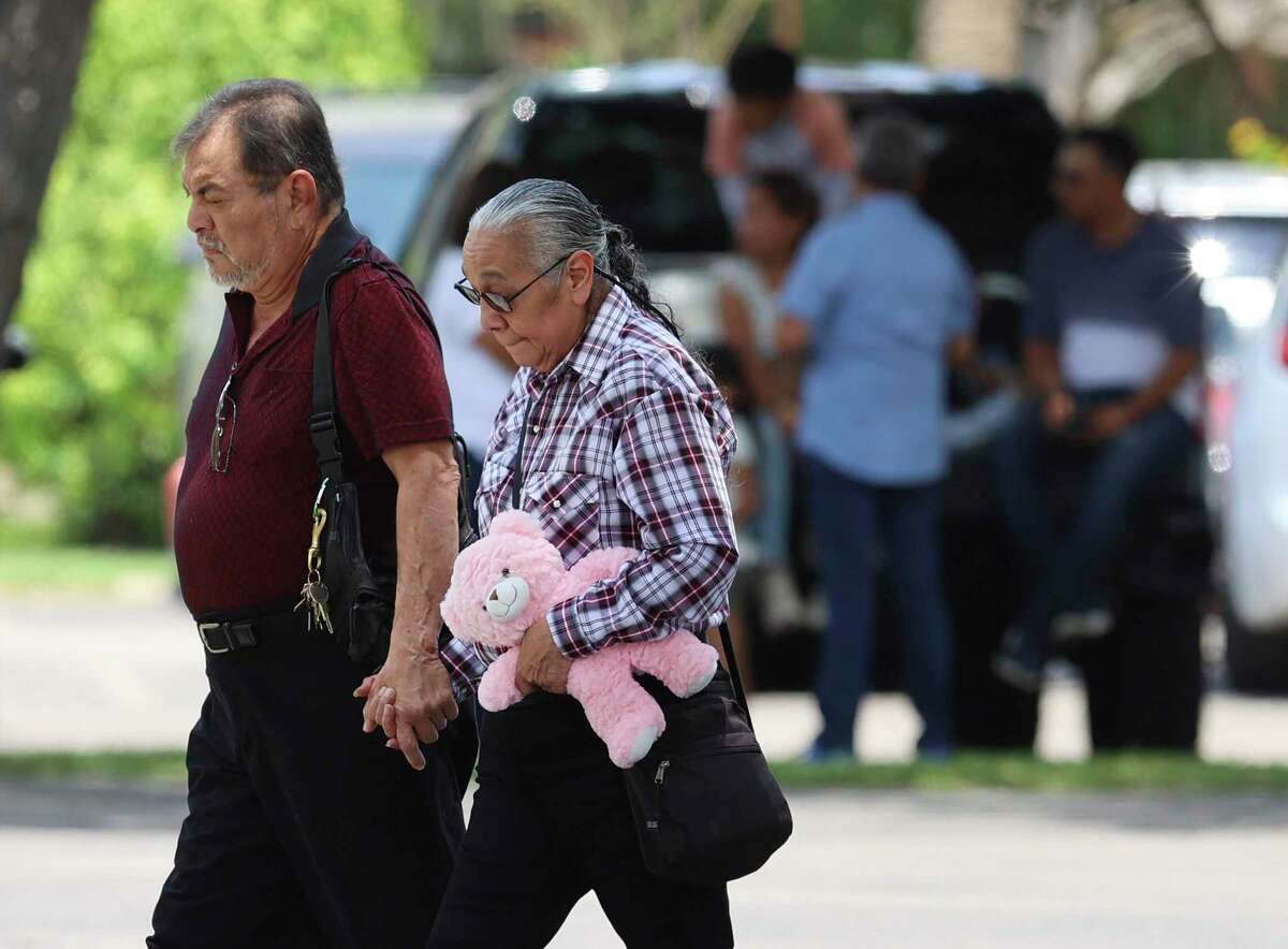 A couple attend the visitation for Maite Yuleana Rodriguez at Rushing-Estes-Knowles Funeral Home on Monday, May 30, 2022. Visitations were held for Rodriguez and another student, Amerie Jo Garza, two of the 19 students who perished in the Robb Elementary School shootings on Monday, May 30, 2022.