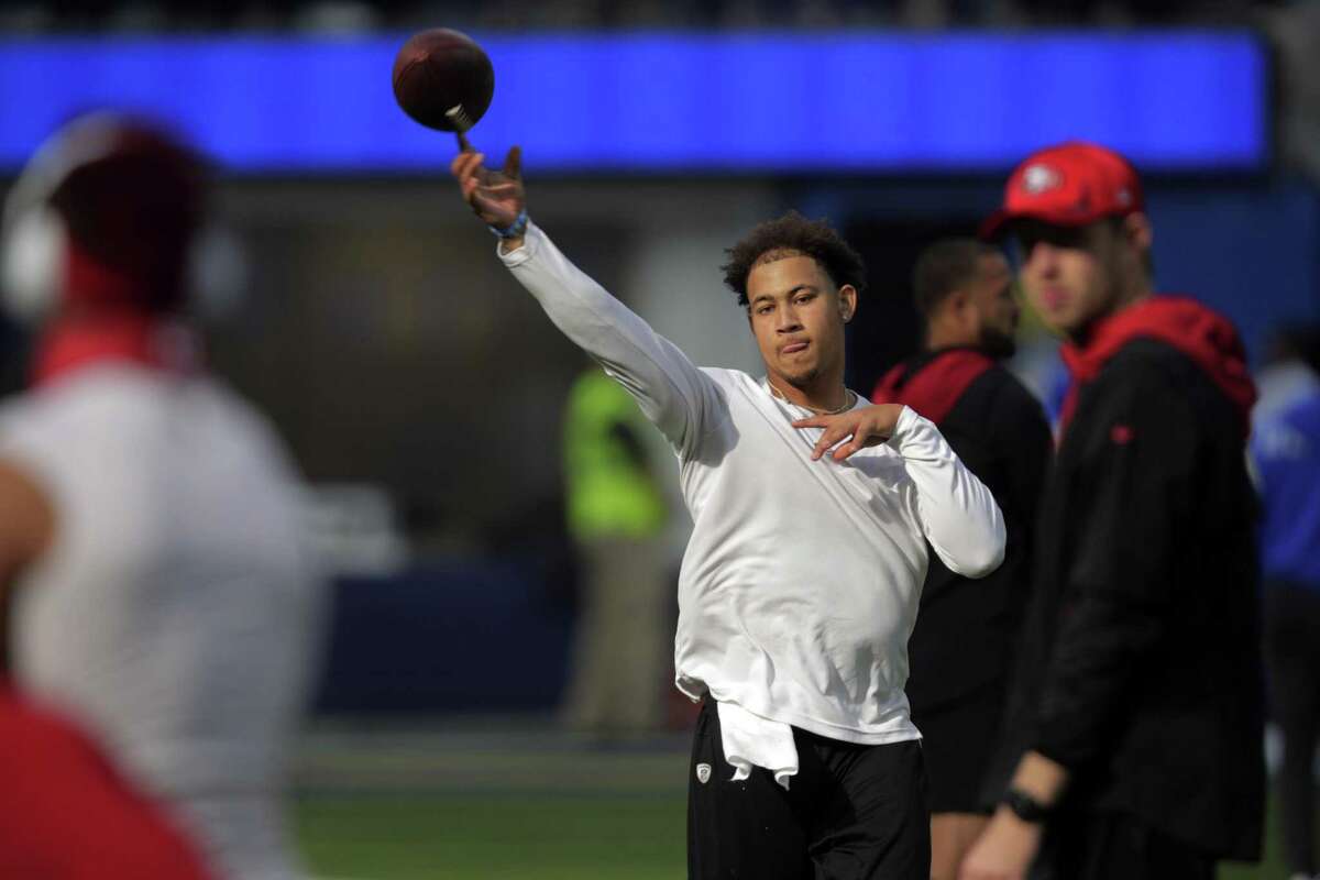 Trey Lance (5) warms up before the San Francisco 49ers played the Los Angeles Rams in the NFL Championship game at SoFi Stadium in Inglewood, Calif., on Sunday, January 30, 2022.