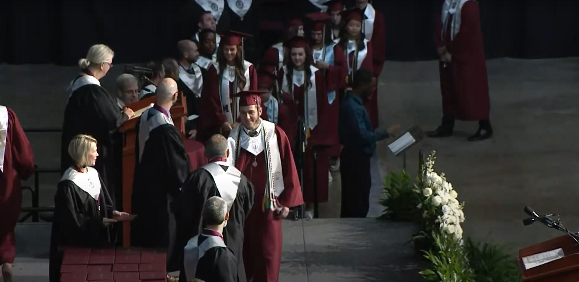 Magnolia ISD seniors walk the stage during graduations at Reed Arena