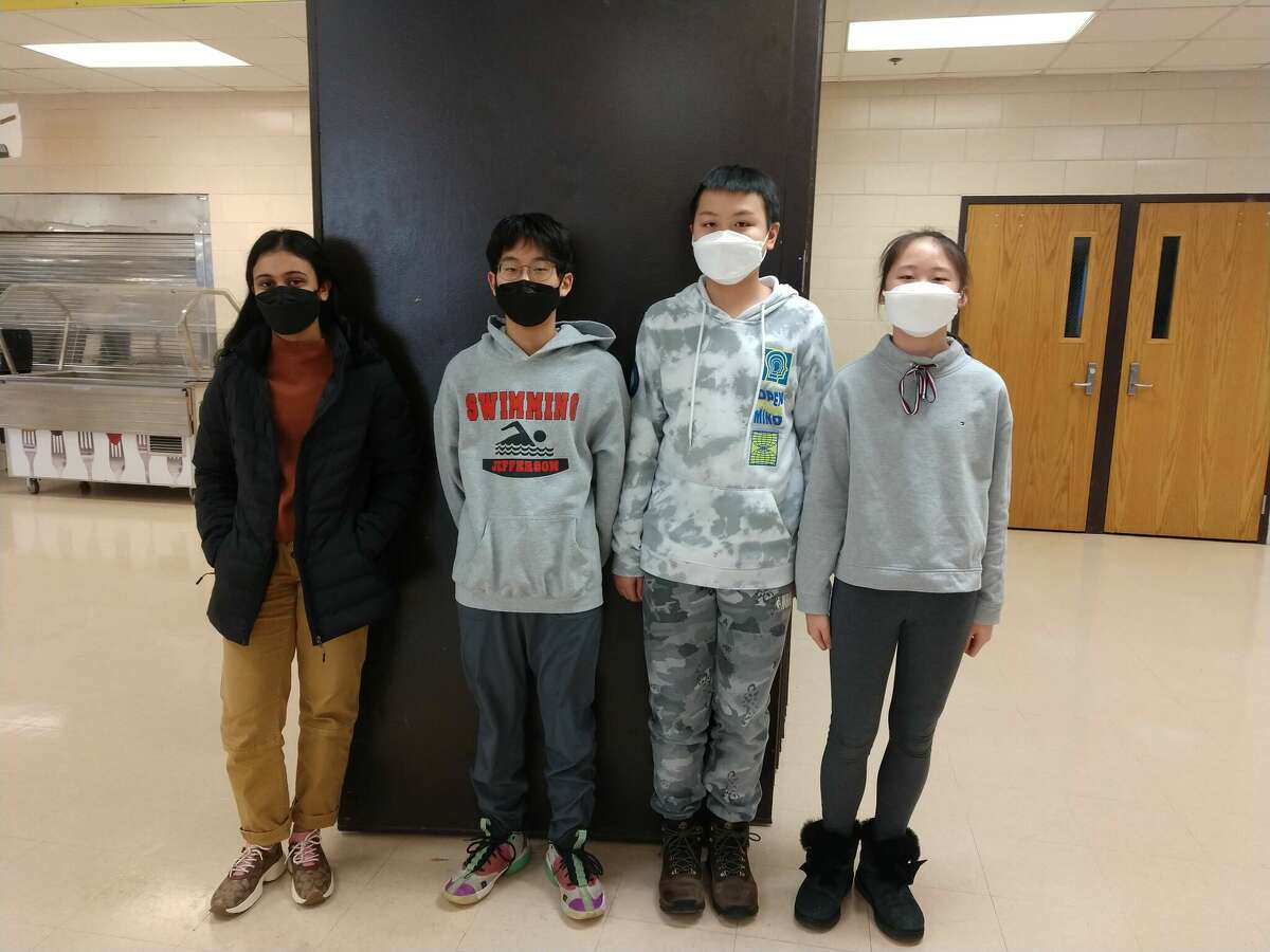From left to right, Kanushi Desai, Ian Koh, Louis Huang and Emma Huang pose for a photo as the 2022 YBTC Michigan Finalists of Jefferson Middle School