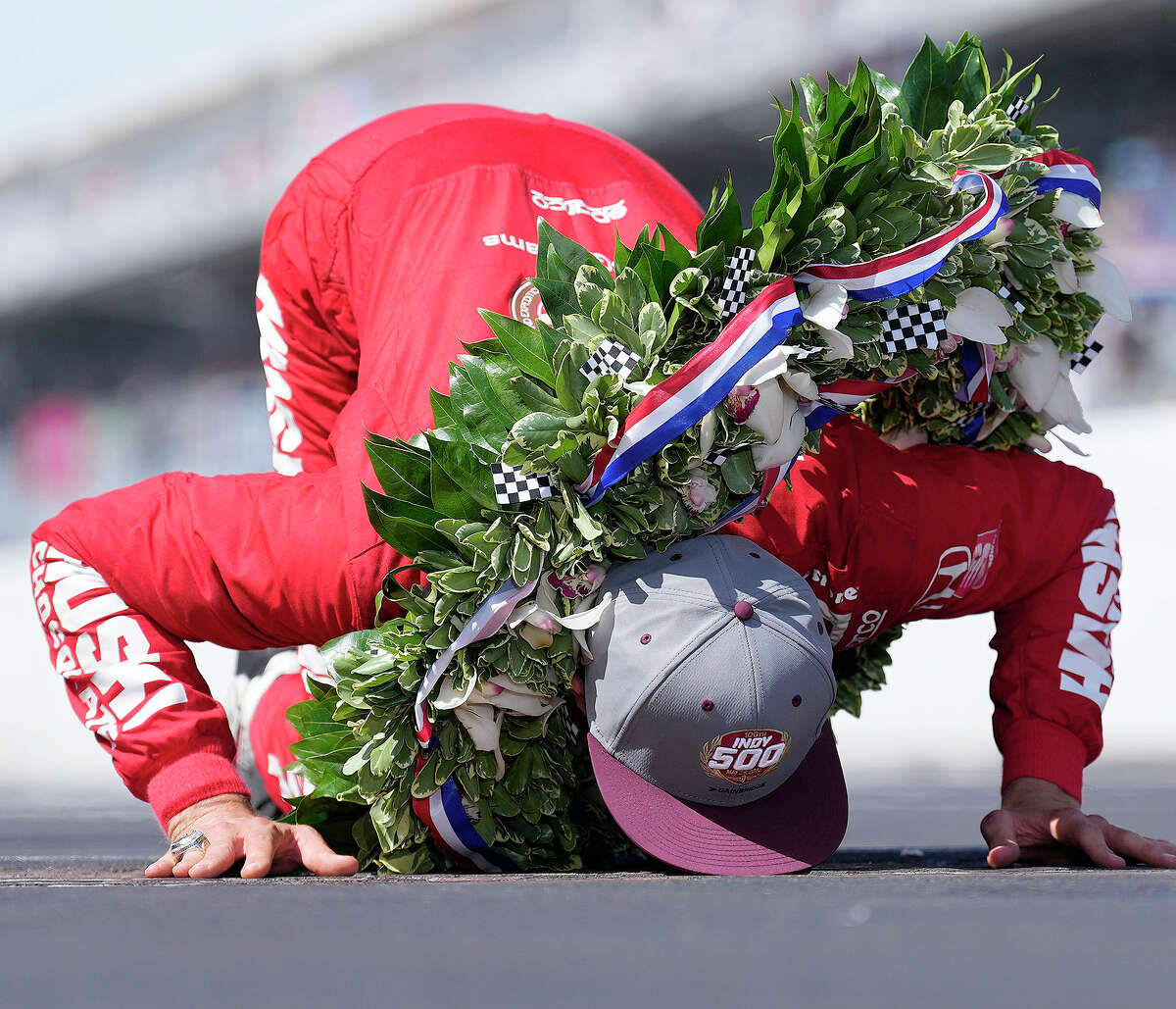 Marcus Ericsson of Sweden celebrates after winning Sunday's Indianapolis 500 by kissing the yard of bricks at Indianapolis Motor Speedway.