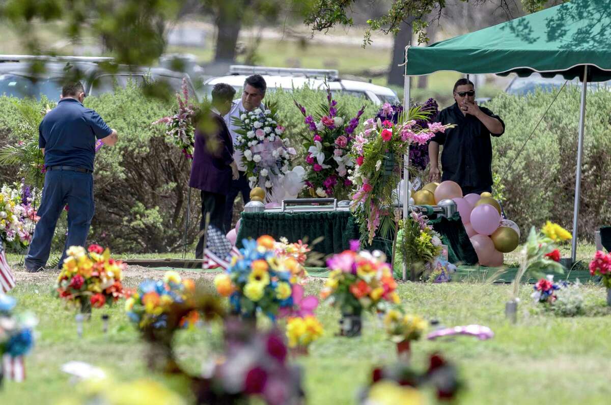 People prepare the gravesite Tuesday, May 31, 2022 in Uvalde for the burial of Amerie Jo Garza, one of 19 children and two adults at Robb Elementary School killed May 24, 2022 by a gunman with an assault rifle. Garza is the first of the victims to be buried.