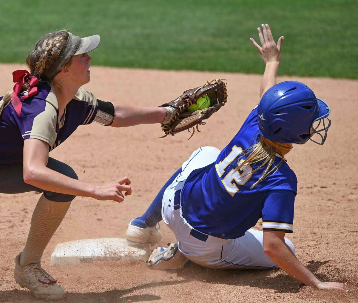 D’Hanis shortstop Mabry Hermann tags out Dodd City’s Lindsey Mauppin in Class 1A state semifinal softball action at McCombs Field in Austin on Tuesday, May 31, 2022. D’Hanis won the game, 2-0.