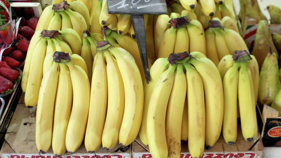 BARI, ITALY - APRIL 28: Bunches of bananas on April 28, 2022 in Bari, Italy. Spending on the local market to help the local economy and the environment